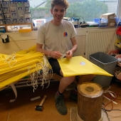 Matt Cox, finishing off the toggles to go onto the next batch of Scrub bags.