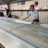 Peter Sanders having a close inspection on the latest scrubs being cut.
