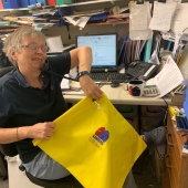 Kenna Sanders taking all the phone calls from frontline staff needing their scrub bags. #withlovex